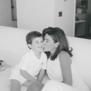 Mother and child on sofa, black and white photograph